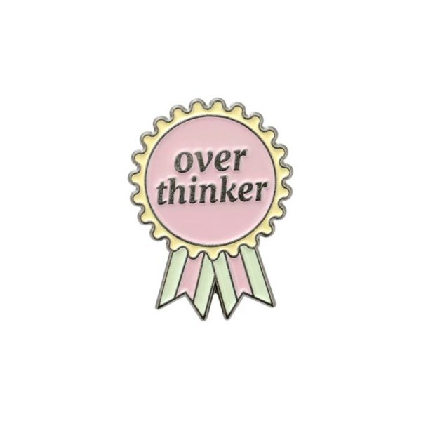 Pin insignia over thinker