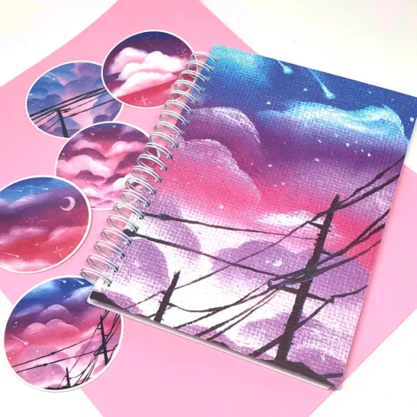 Imagen de libro de pegatinas reutilizable cielo en colores violetas